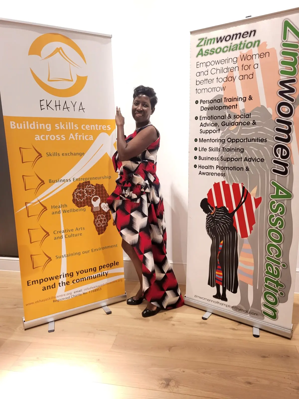Ekhaya representative with community programme banners